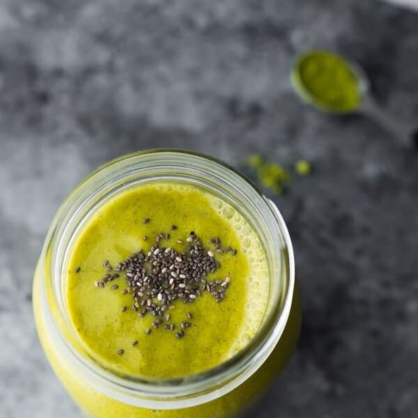 mason jar filled with matcha avocado smoothie