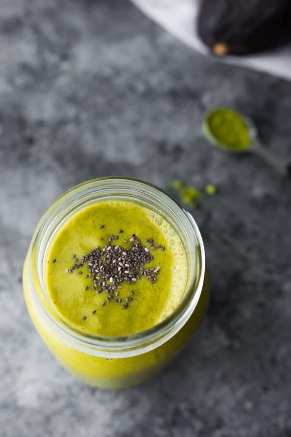 mason jar filled with matcha avocado smoothie