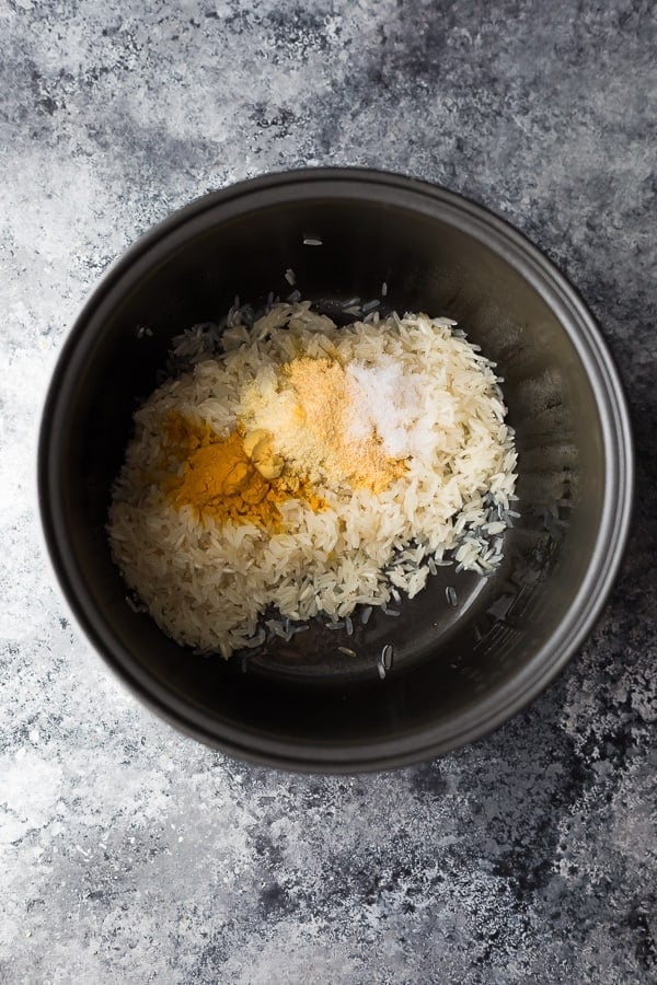 ingredients for yellow rice in a rice cooker