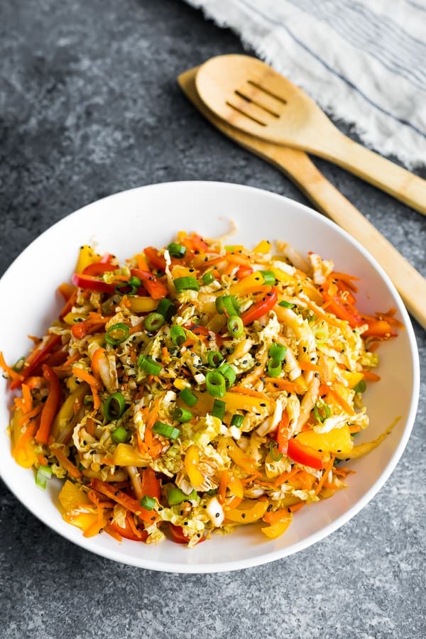 bowl with asian slaw recipe; two spoons in background