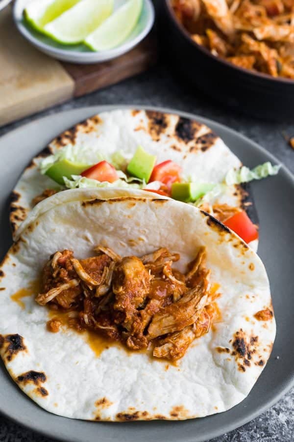 gray plate with salsa chicken in fajitas