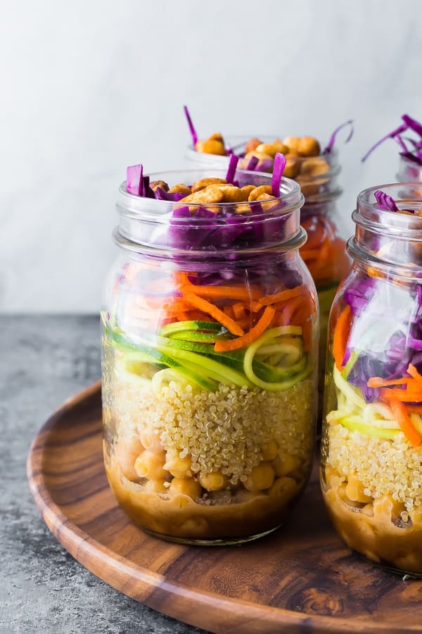 Thai Chickpea Mason Jar Salad on wooden tray