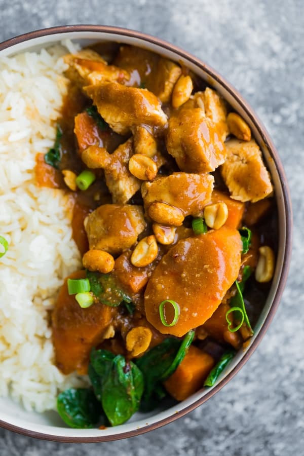 close up shot of the cooked asian peanut chicken in a bowl