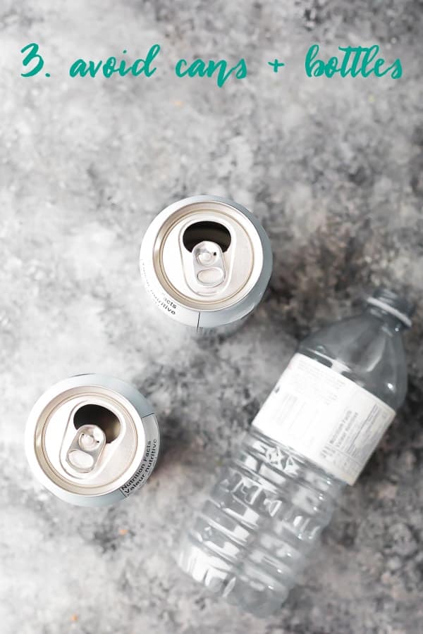 overhead shot of two cans and a plastic bottle with text avoid cans and bottles