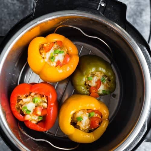 overhead shot of instant pot with turkey stuffed peppers inside