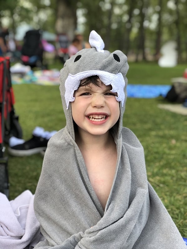 a kid in a shark towel