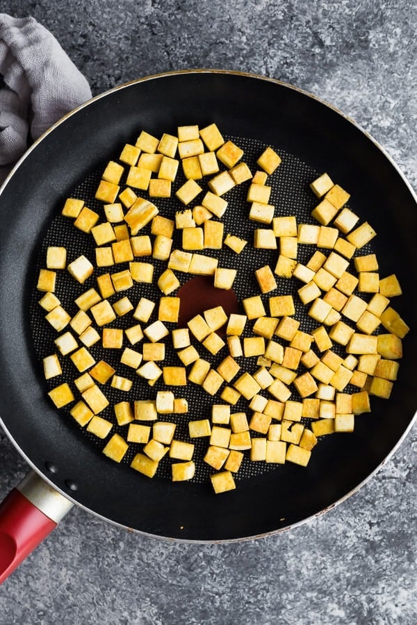 overhead shot of peanut ginger tofu stir fry in frying pan