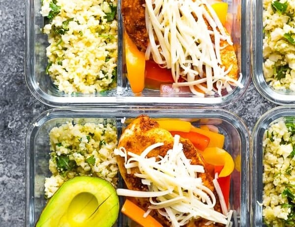 four glass meal prep containers with santa fe chicken meal prep bowls
