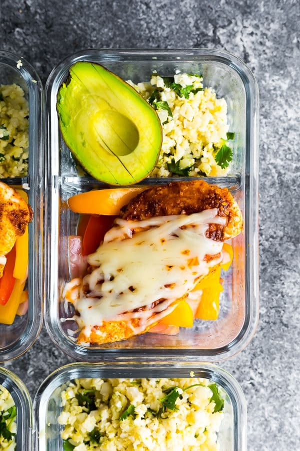 overhead shot of santa fe chicken meal prep bowls in glass meal prep container