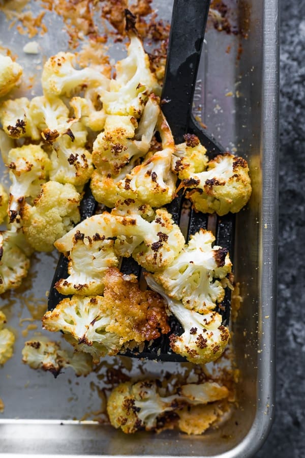 spatula scooping up parmesan roasted cauliflower recipe