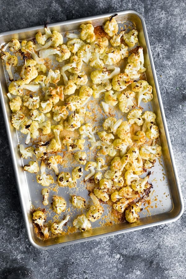 sheet pan with oven roasted cauliflower after baking
