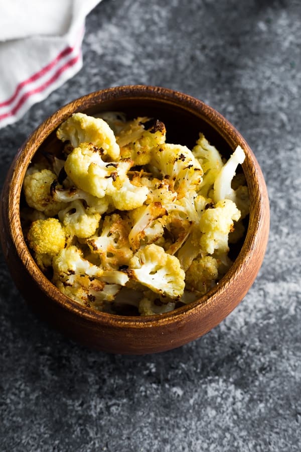 parmesan roasted cauliflower recipe in a brown bowl