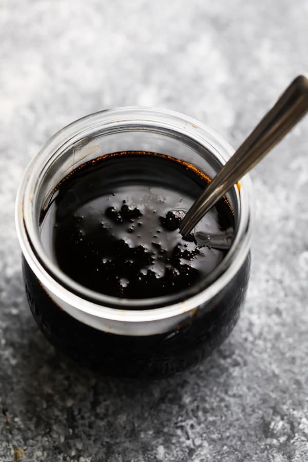 balsamic glaze in a jar with a spoon