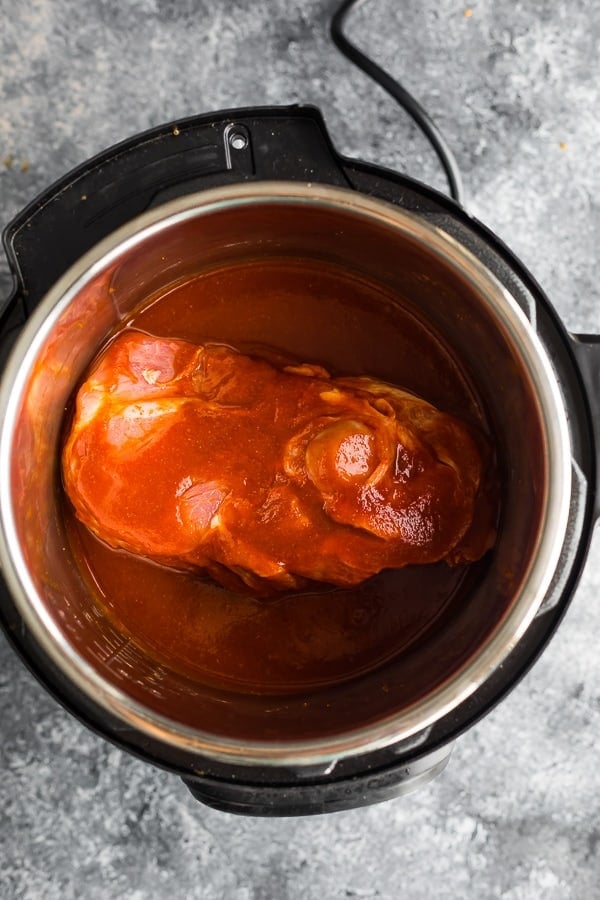 pork shoulder and pulled pork ingredients in an instant pot before cooking