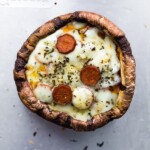 overhead shot of pepperoni pizza stuffed portobello mushroom