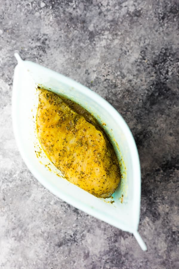 lemon pepper chicken breast marinating in a silicone bag
