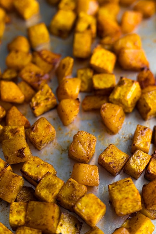 close up shot of roasted butternut squash on baking sheet