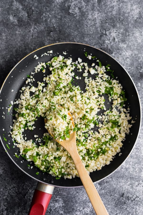 cooking the Cilantro lime cauliflower rice in a pan
