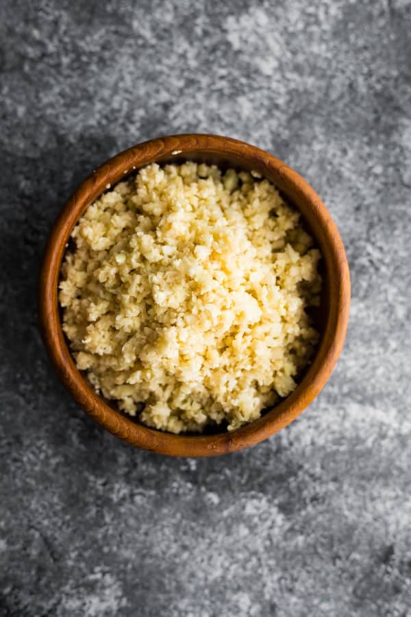coconut cauliflower rice in a brown bowl