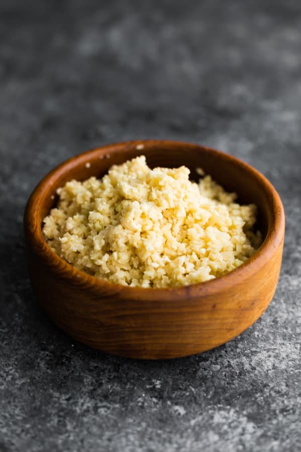 Coconut cauliflower rice in wood bowl