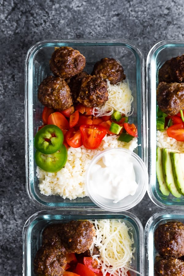 overhead view of Low Carb Meatball Burrito Bowls in glass meal prep containers