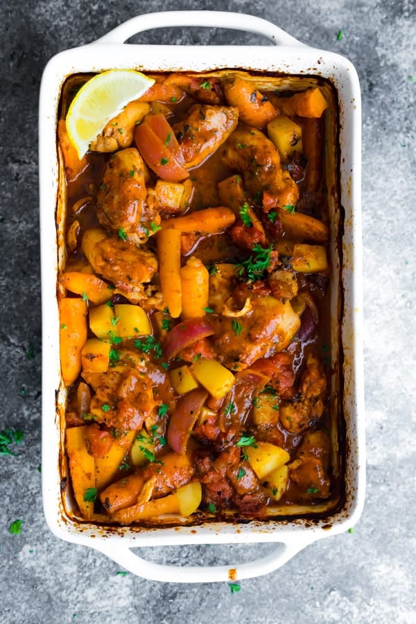 Freezer Portuguese Chicken Bake in white casserole dish