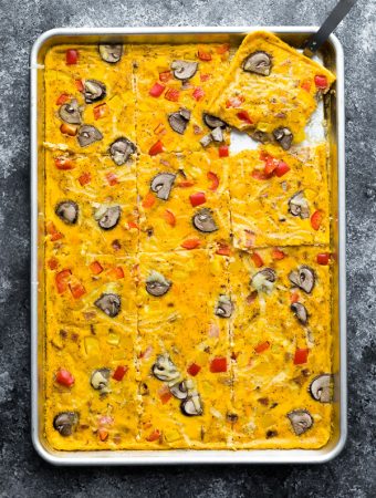 overhead shot of sheet pan eggs on gray background