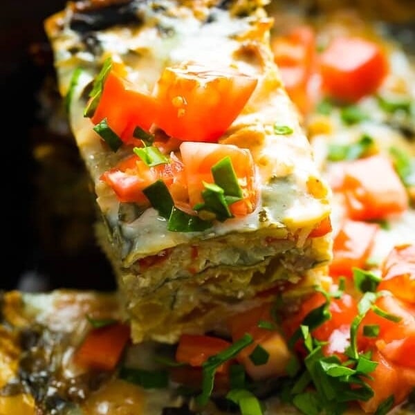 close up shot of crockpot breakfast casserole with fresh tomatoes