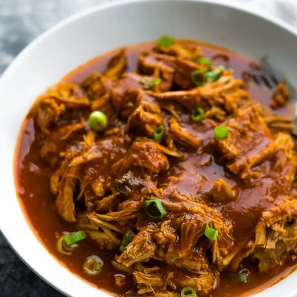 white bowl filled with instant pot pulled pork