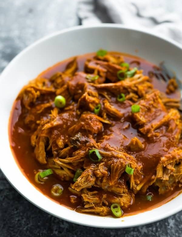 white bowl filled with instant pot pulled pork
