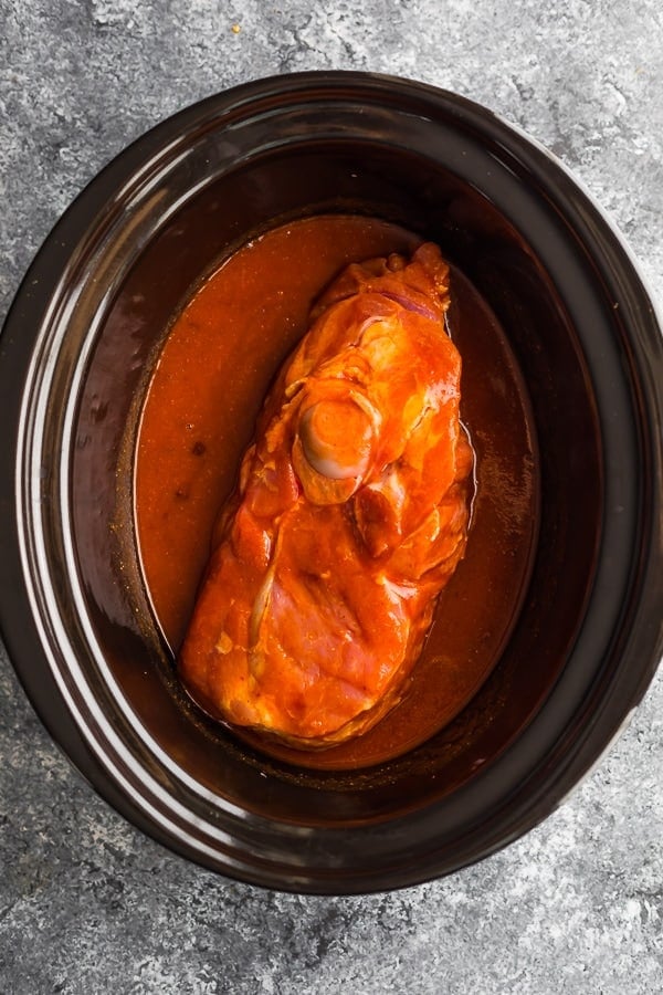 ingredients for crock pot pulled pork in slow cooker before cooking