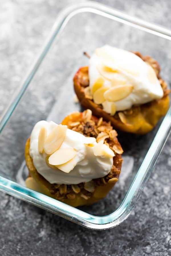 baked apples in meal prep container with yogurt and almonds