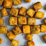 overhead shot of baked tofu cubes on baking pan