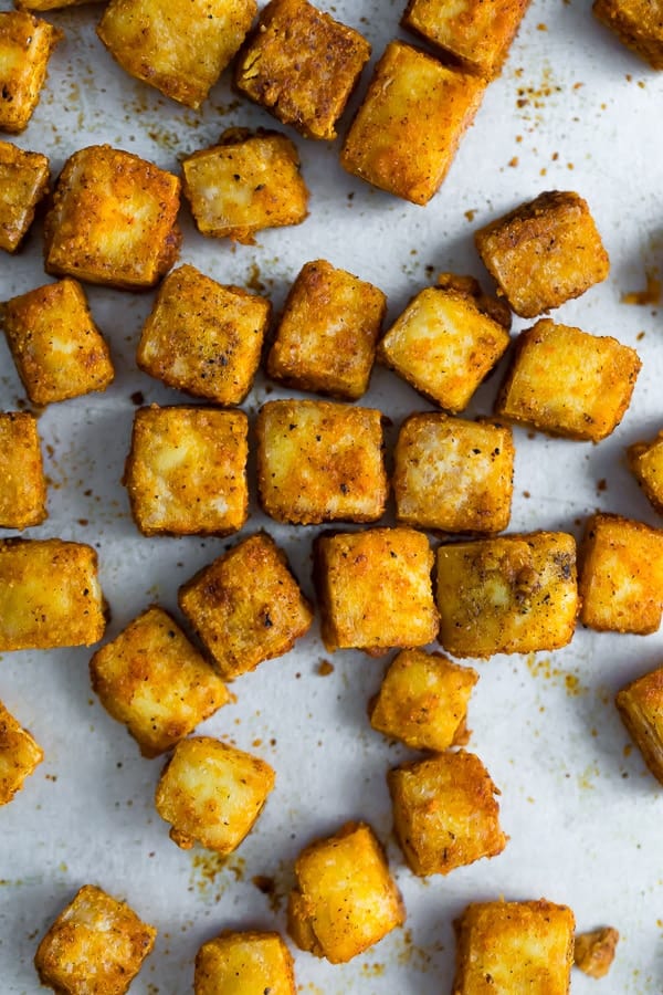 overhead shot of baked tofu cubes on baking pan