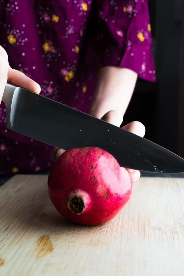 how to cut a pomegranate- horizontally across the fruit