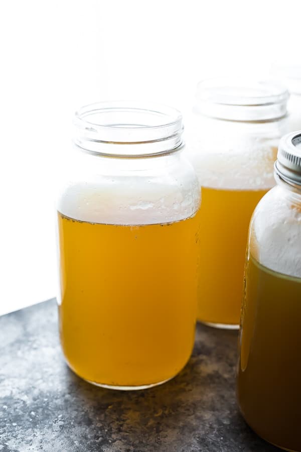 three jars of leftover turkey bone broth