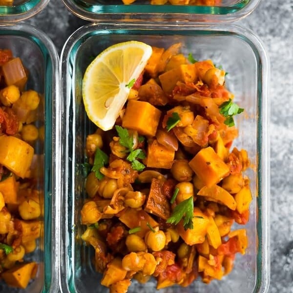 overhead shot of glass container filled with vegan Moroccan chickpea skillet