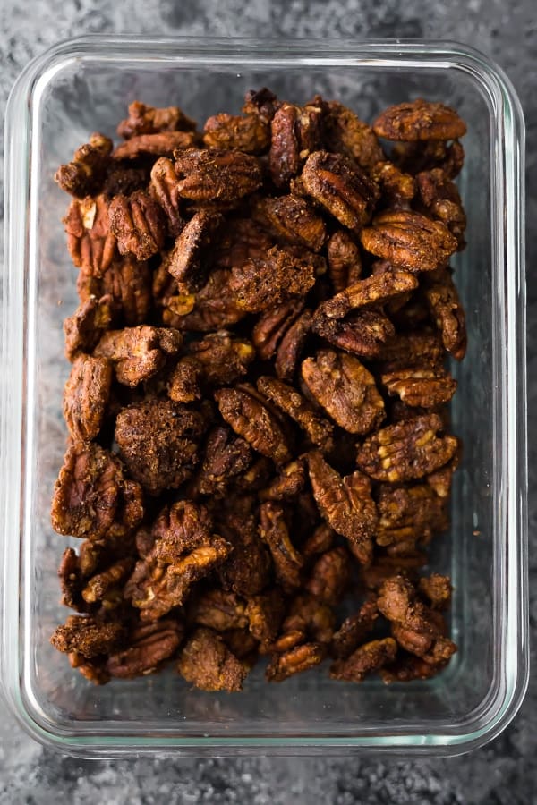 cinnamon roasted pecans in storage container