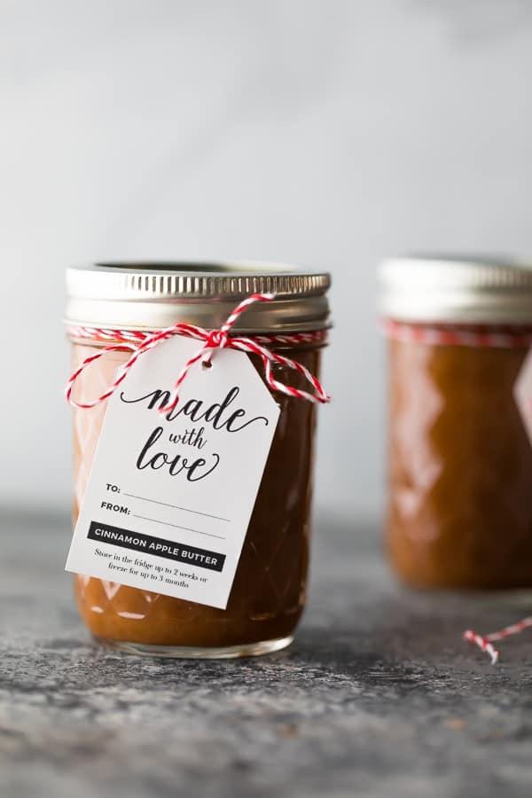 apple butter crockpot recipe in mason jar with gift tag