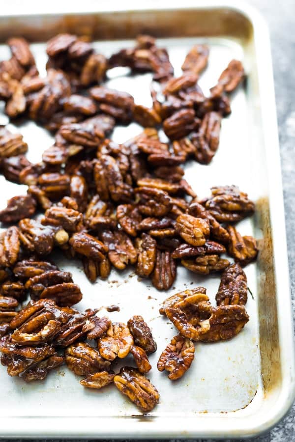 showing how to roast pecans on a baking dish