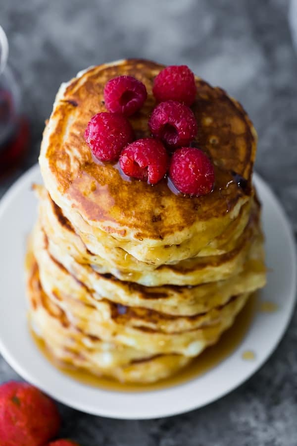 a tall stack of fluffy cottage cheese pancakes