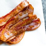 Slices of bacon on a white paper towel