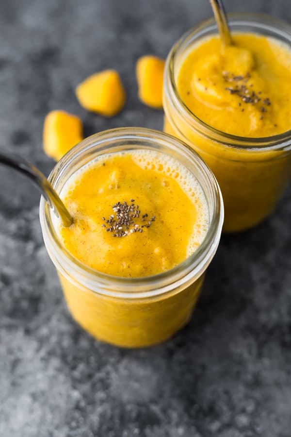 mango smoothie recipe in mason jar with reusable straw