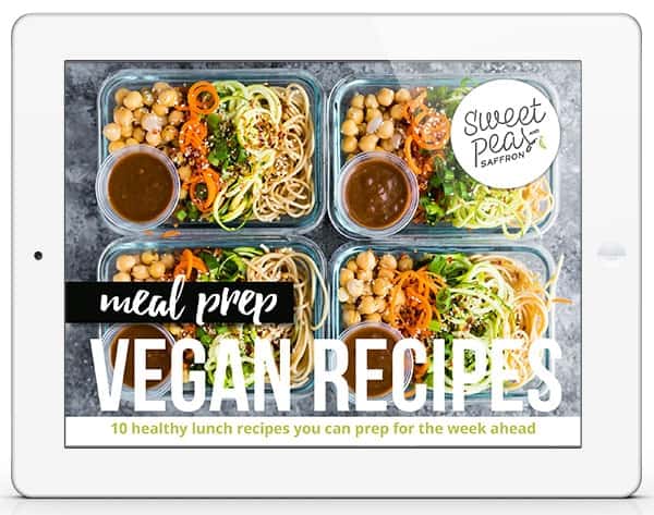 Overhead shot of four meal prep containers with vegan recipes