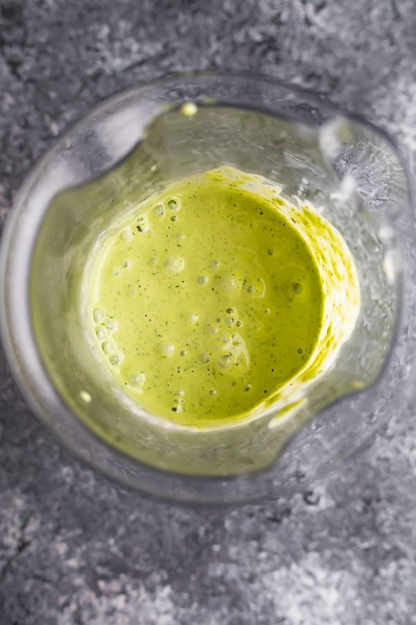 green goddess dressing in a cup after blending