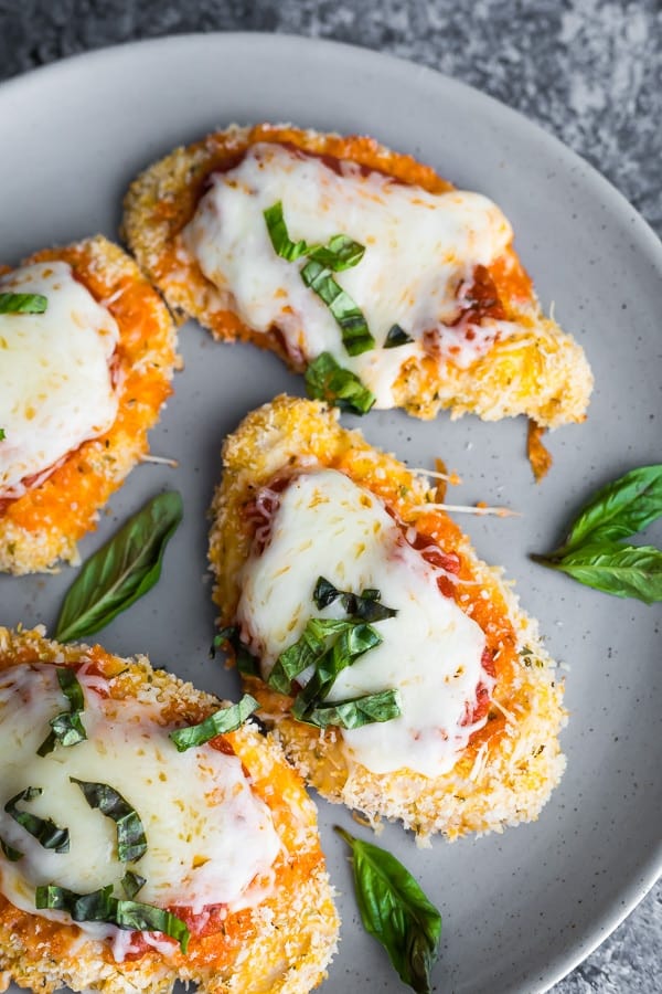 how to make chicken parmesan- showing chicken parm on plate after baking