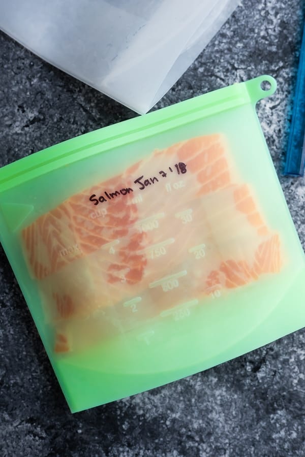 showing how to freeze salmon- salmon in re-usable silicone freezer bag