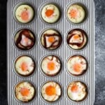 overhead shot of a variety of baked eggs in muffin tin