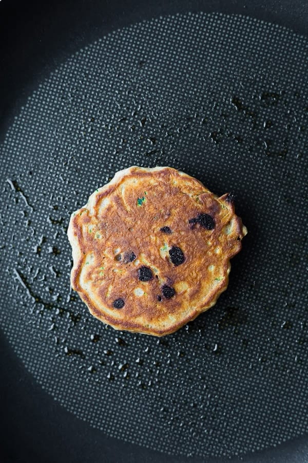 cooking the chocolate chip pancakes in a nonstick skillet, overhead view