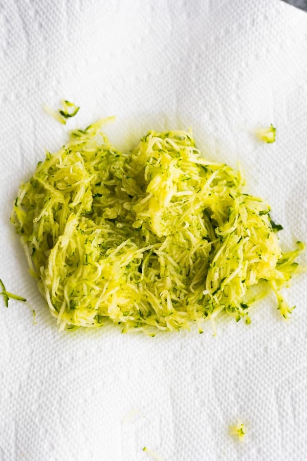 shredded zucchini on paper towel from above